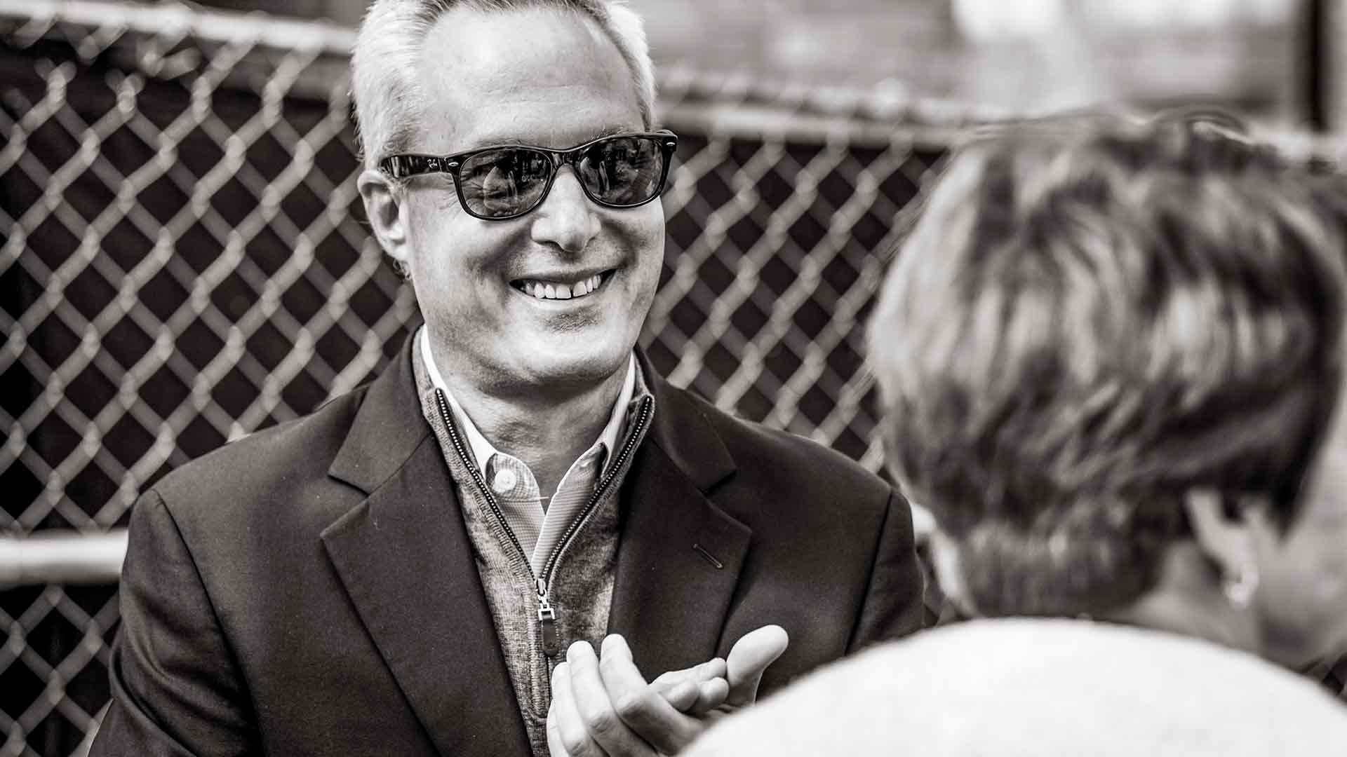Black and white photo of Ken Valosky wearing sunglasses on construction site.