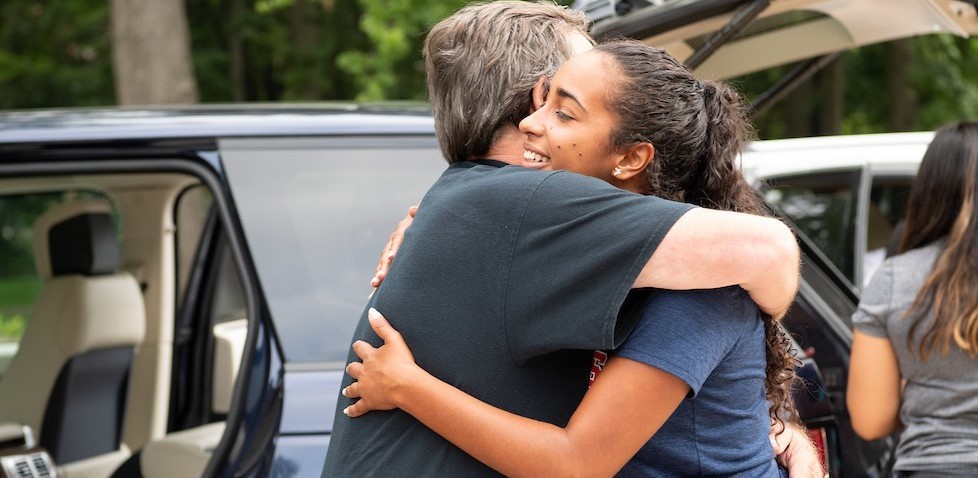 Student and parent embracing on Villanova's campus