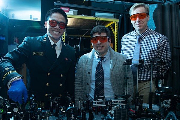 Ronald Warzoha Ronald Warzoha stands with two students in the lab.