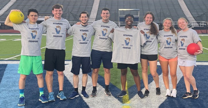 Students posing for kickball champion photo
