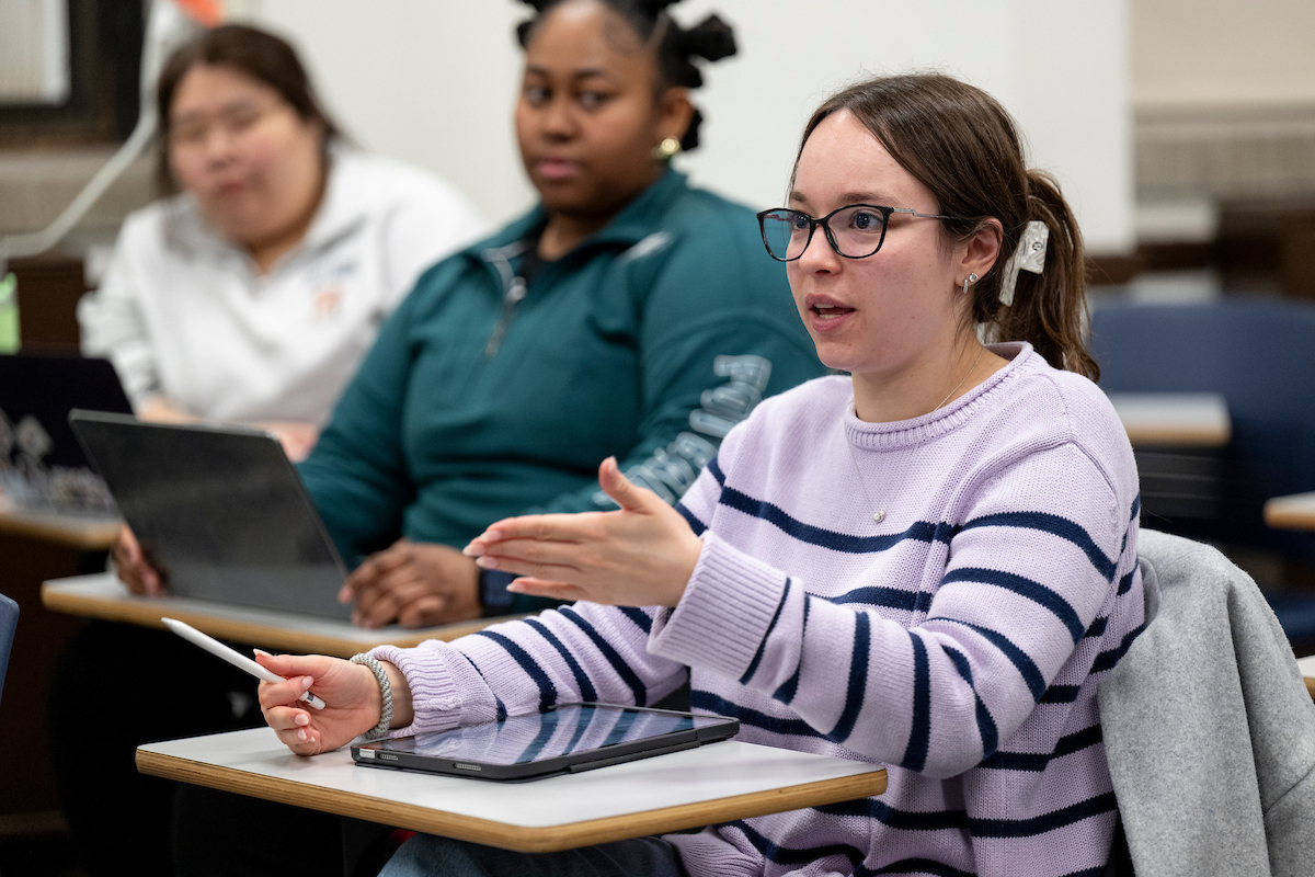 Graduate students seated in a classroom. Graduate students seated in a classroom.