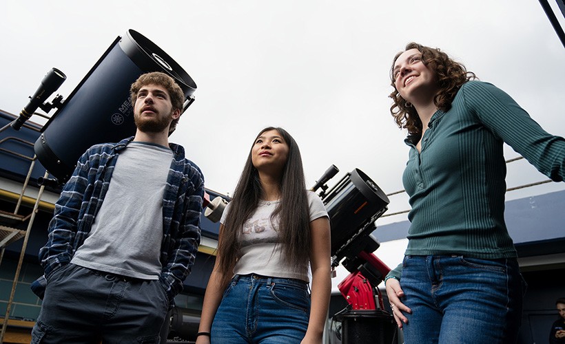 Three students in the Villanova observatory. Three students in the Villanova observatory.