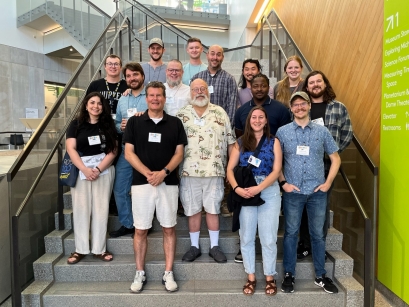 Pictured here with current and former students, Dr. Bauer (center) and Dr. Jackman (front, left) are complementary forces in the Biology department, helping prepare future leaders of the field in unique ways.
