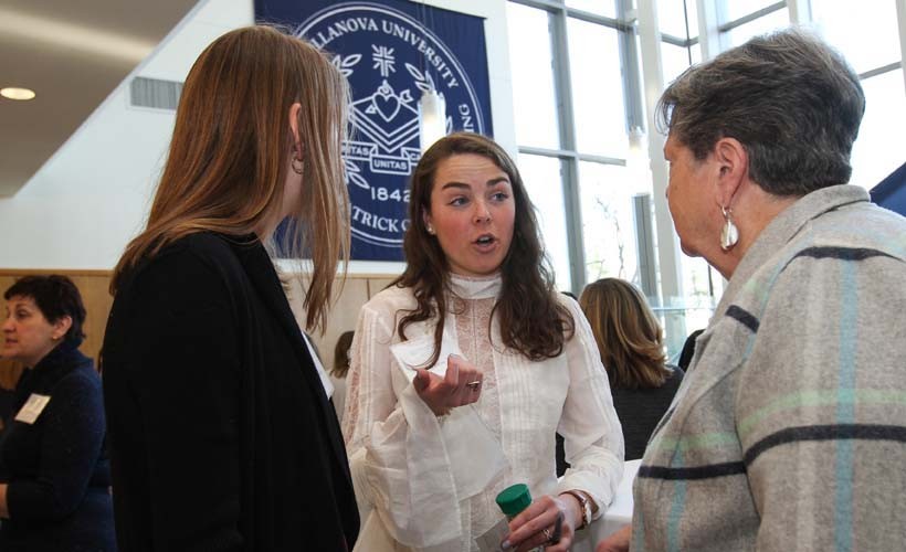 Attendees at an event reception.