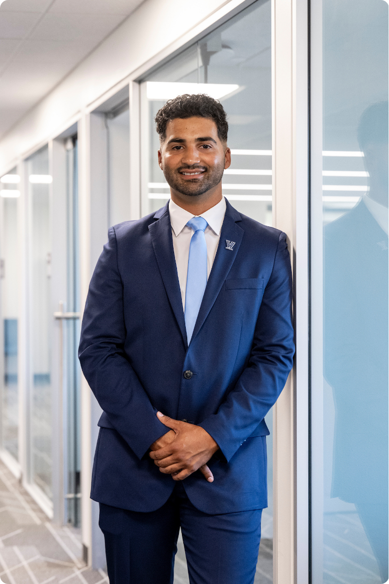 man standing in a corporate hallway