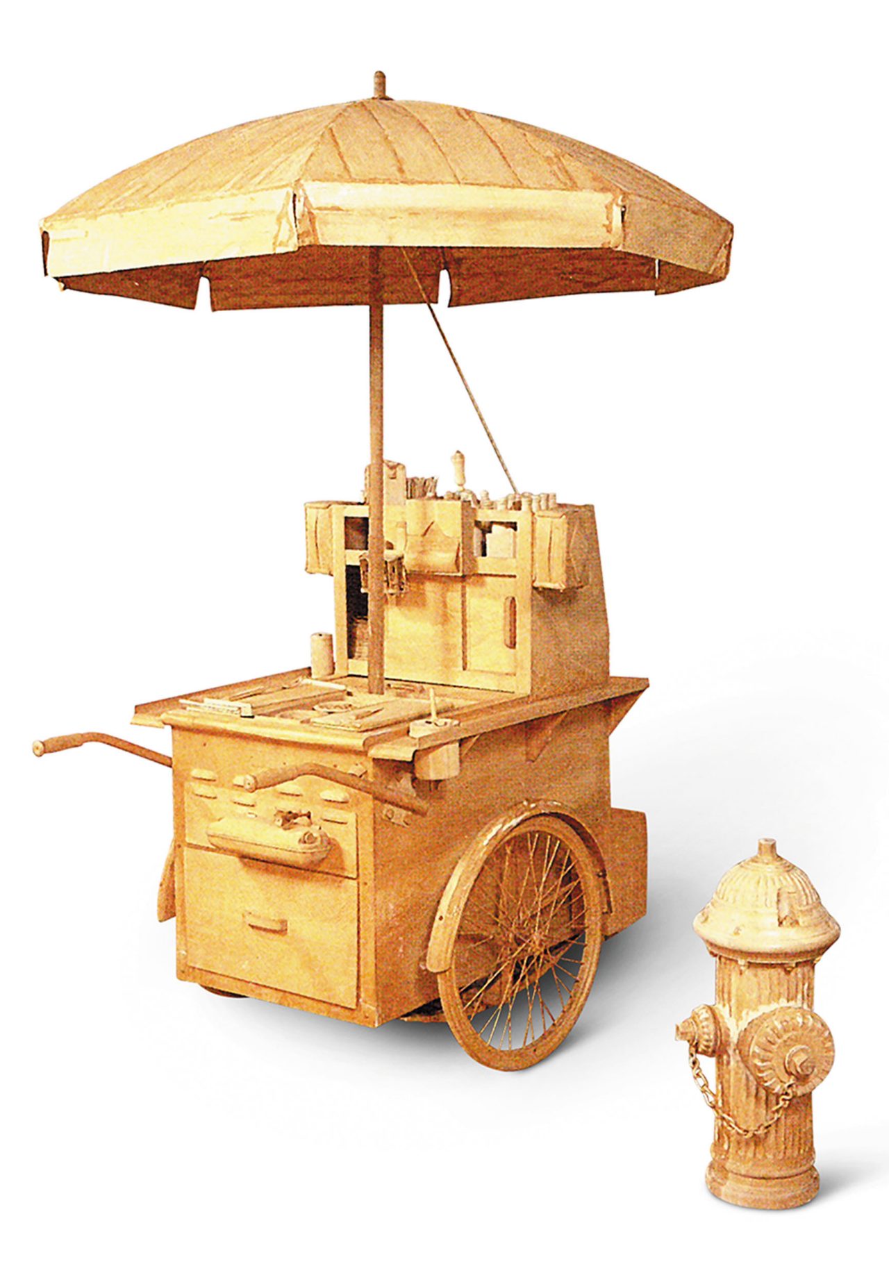 wooden hot dog cart alongside a wooden fire hydrant