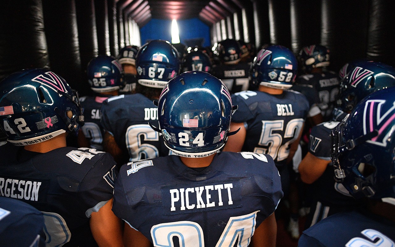 back of Villanova Football team as they wait to run through the tunnel