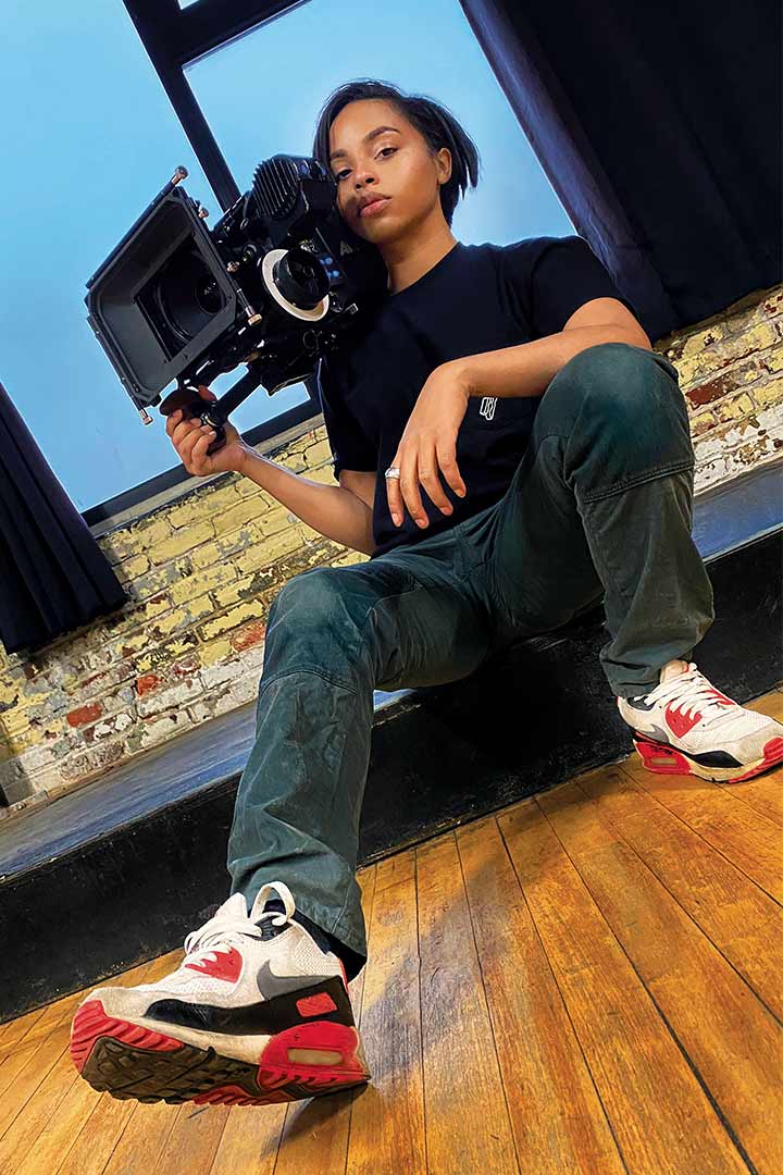 director Simone Holland holding a camera